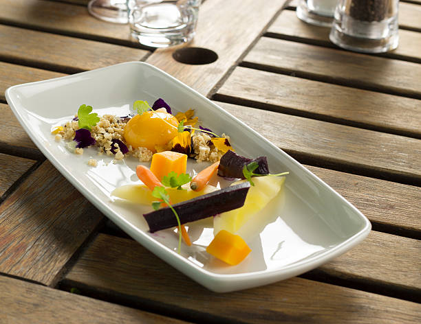Heirloom carrots with confit egg yolk, hazelnut nasturtium crumble