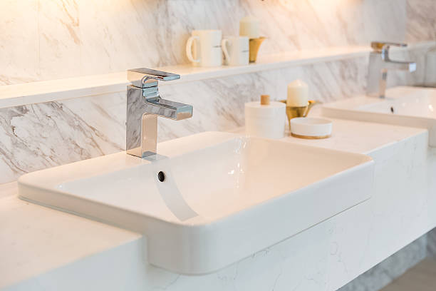 istock closeup faucet in bathroom 544668476