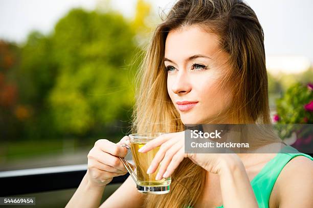 Young Woman Drinking Green Tea Outdoors Stock Photo - Download Image Now - Dieting, Tea - Hot Drink, Green Tea