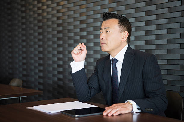 istock Mature Japanese businessman looking away, thinking 544670270