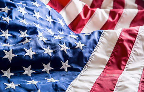 istock USA flag. American flag. American flag blowing wind. 544672208