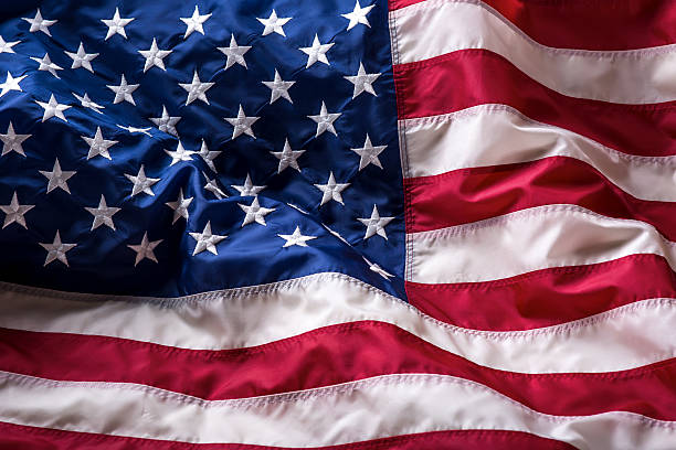 istock USA flag. American flag. American flag blowing wind. 544672702