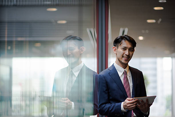 istock Asian businessman with a tablet 544673882