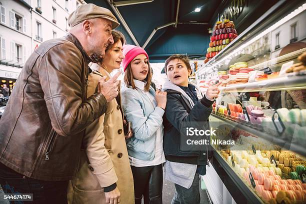 French Macarons Shopping In Paris France Stock Photo - Download Image Now - Paris - France, Family, Bakery