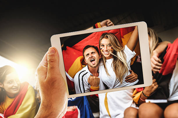 istock photographing the supporters 544674860