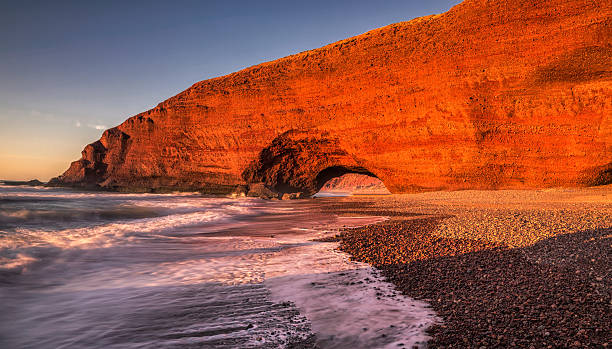 istock Red arches of Legzira beach 544675472