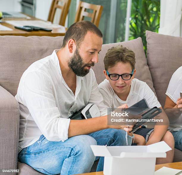 Family And A Breadboard Stock Photo - Download Image Now - Activity, Adult, Adult Offspring