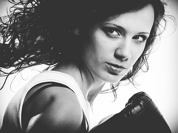 istock Boxer girl exercise with boxing gloves. 544677574