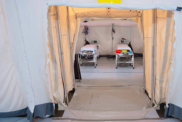 Field hospital tent with beds A field hospital is a small mobile medical unit, or mini hospital, that temporarily takes care of casualties on-site before they can be safely transported to more permanent hospital facilities. Oxygen stock pictures, royalty-free photos & images