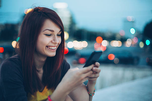 istock Young woman texting in the evening 544678380