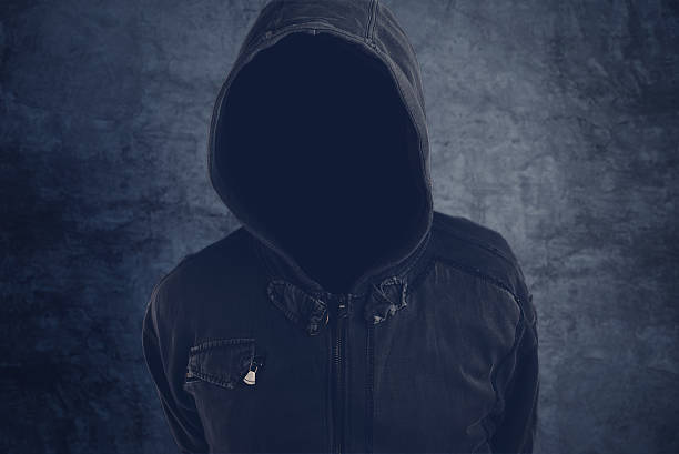 istock Unrecognizable hooded soccer hooligan portrait 544679580