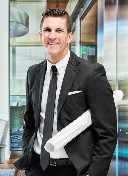istock Cheerful businessman standing in office 544680054