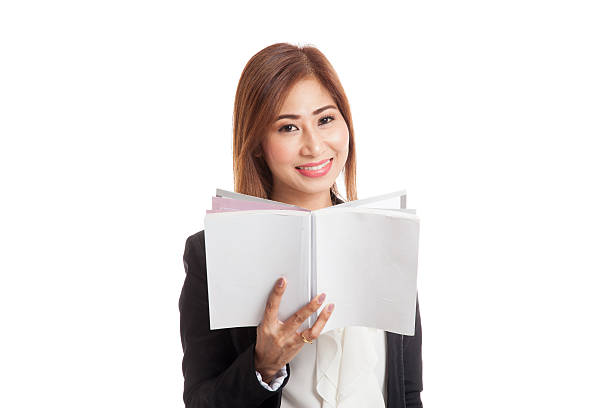 istock Young Asian business woman with a book 544682242