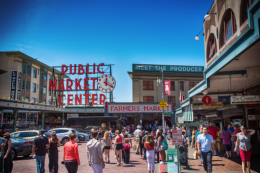 Seattle, United States - June 6, 2016:  Crowds at the entrance to Pikes Place Market in Seattle Washington