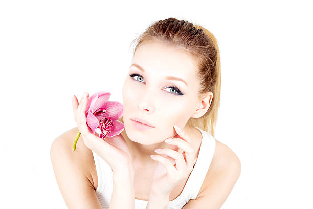Beautiful woman holding a flower