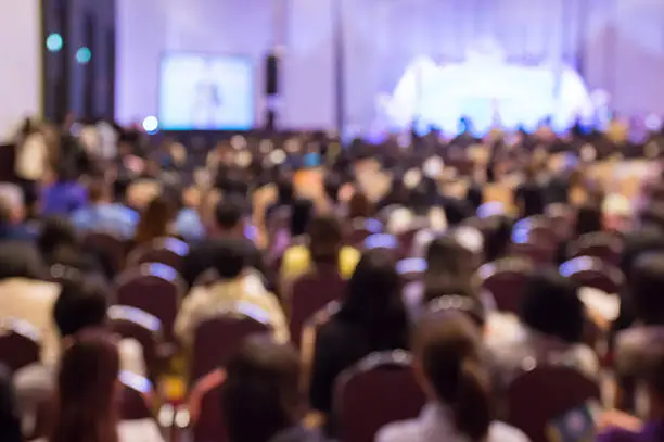 Photo of Blur  audience sitting in hall or auditorium  or classroom