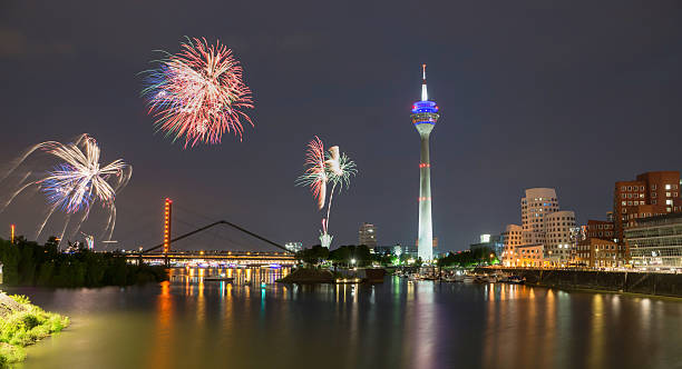 Firework in Dusseldorf media harbor. Firework in Dusseldorf ist twice a year. Once at the beginning and end of the funfair and the other big one in the context of the japanese day. media harbor photos stock pictures, royalty-free photos & images
