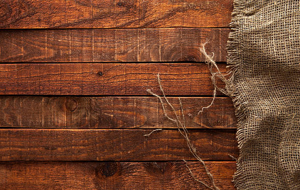istock Dark wood with old burlap texture, top view 544713826