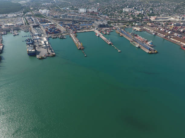 istock Industrial seaport, top view. Port cranes and cargo ships. 544715808