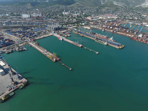 istock Industrial seaport, top view. Port cranes and cargo ships. 544716048