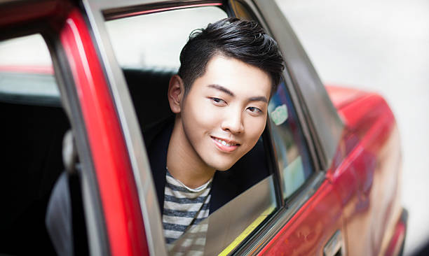 istock Happy Commuter Using Taxi Services in Asia 544716886