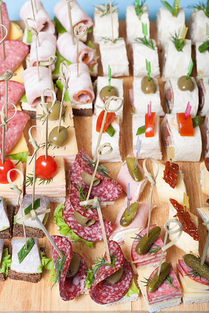 istock Different kinds of snacks canape on skewers. Selective focus 544718228