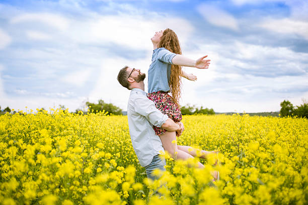 istock Man with girl on yellow meadow. 544718532