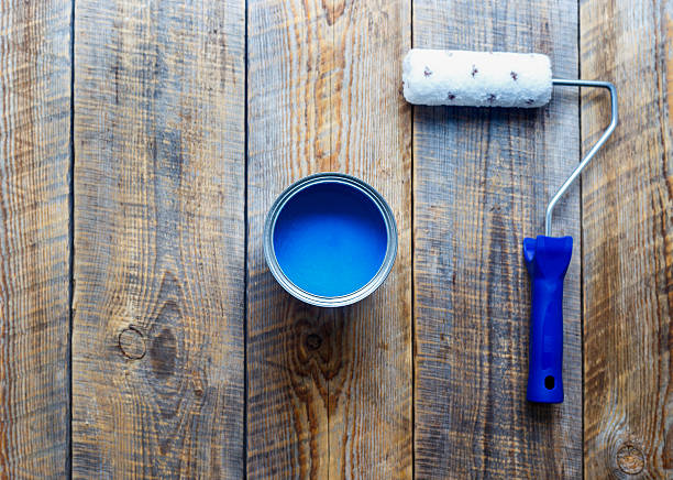 istock painting with can of blue paint and roller top view 544718736