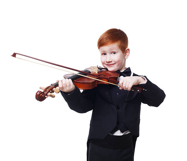istock Cute redhead child boy plays violin isolated at white background 544719110