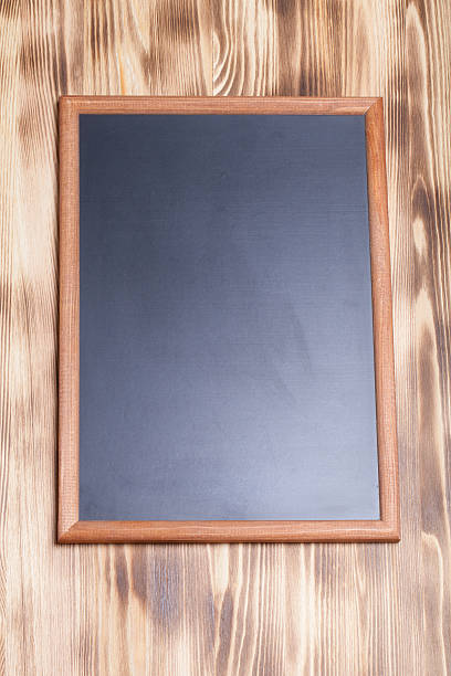 istock New light wooden burned texture with chalk board for background 544719698
