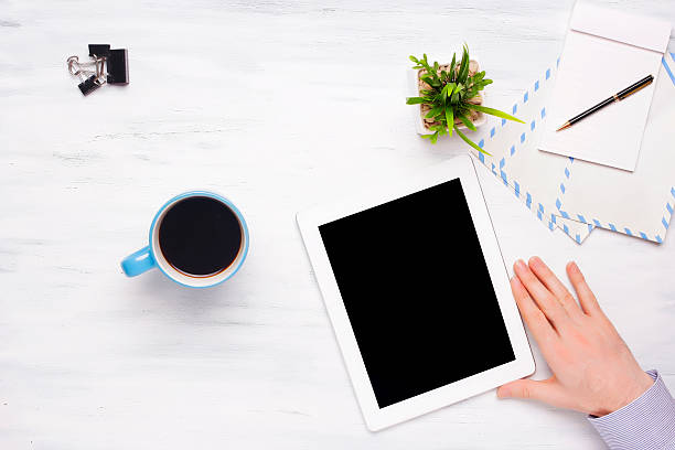 istock Top view of business man holding tablet. 544720402