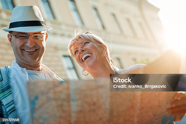 Couple Of Tourists Stock Photo - Download Image Now - Mature Couple, Vacations, Travel
