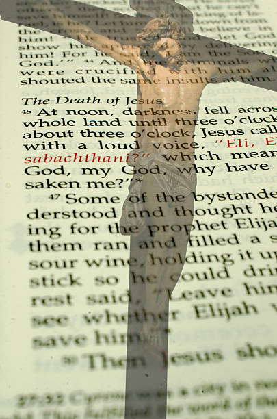 istock Christ on Crucifix over the bible passage on his death 544721700