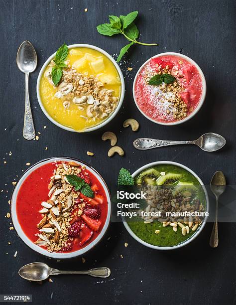 Healthy Summer Breakfast Concept Colorful Fruit Smoothie Bowls With Nuts Stock Photo - Download Image Now