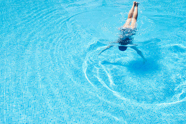 istock Young Women is Swimming in the Pool 544722624