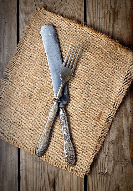 istock Vintage knife and fork on a wooden background 544722666