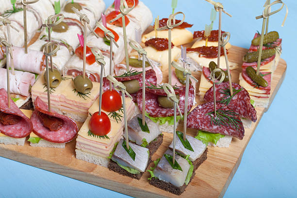 istock Different kinds of snacks canape on skewers. Selective focus 544723320