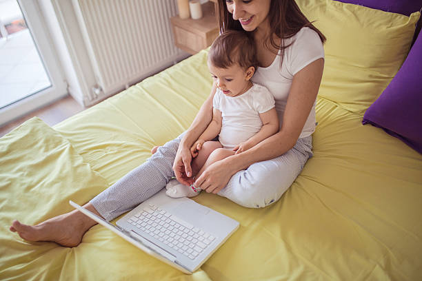 istock Mom and child on laptop 544724480