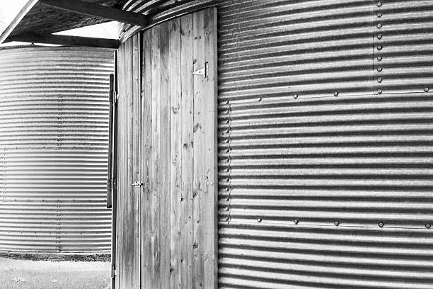 istock Corrugated Steel Grain Storage Bin with Wood Door 544725214