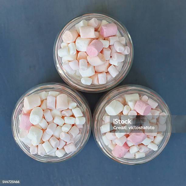 Three Glass Jars Filled To Brim Marshmallow Stock Photo - Download Image Now - Blue, Candy, Chewy