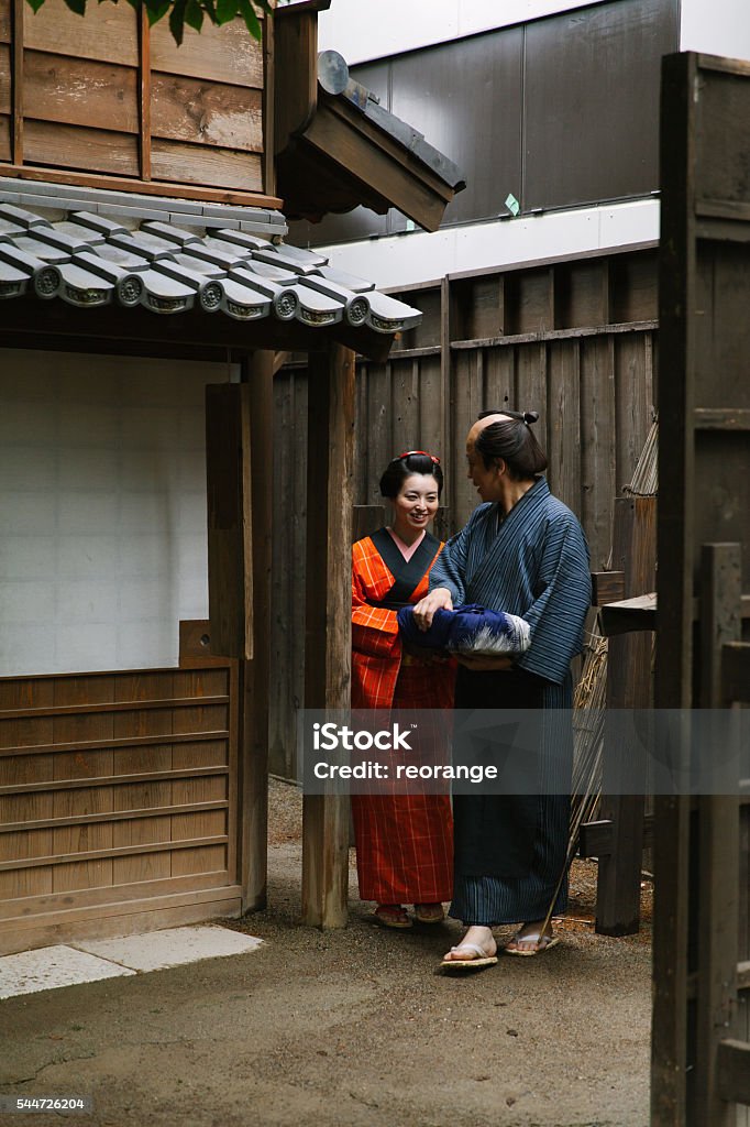 The Japanese couple talking at gareage  in Edo perioud. Achievement Stock Photo