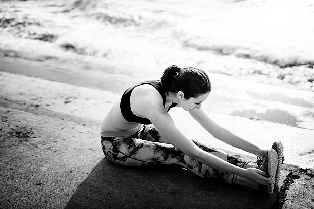 istock Stretching Exercise Training Healthy Lifestyle Beach Concept 544726224