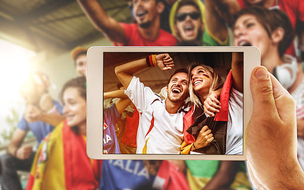 istock photographing the supporters 544726256