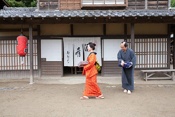 istock The Japanese couple talking at gareage  in Edo perioud. 544726530