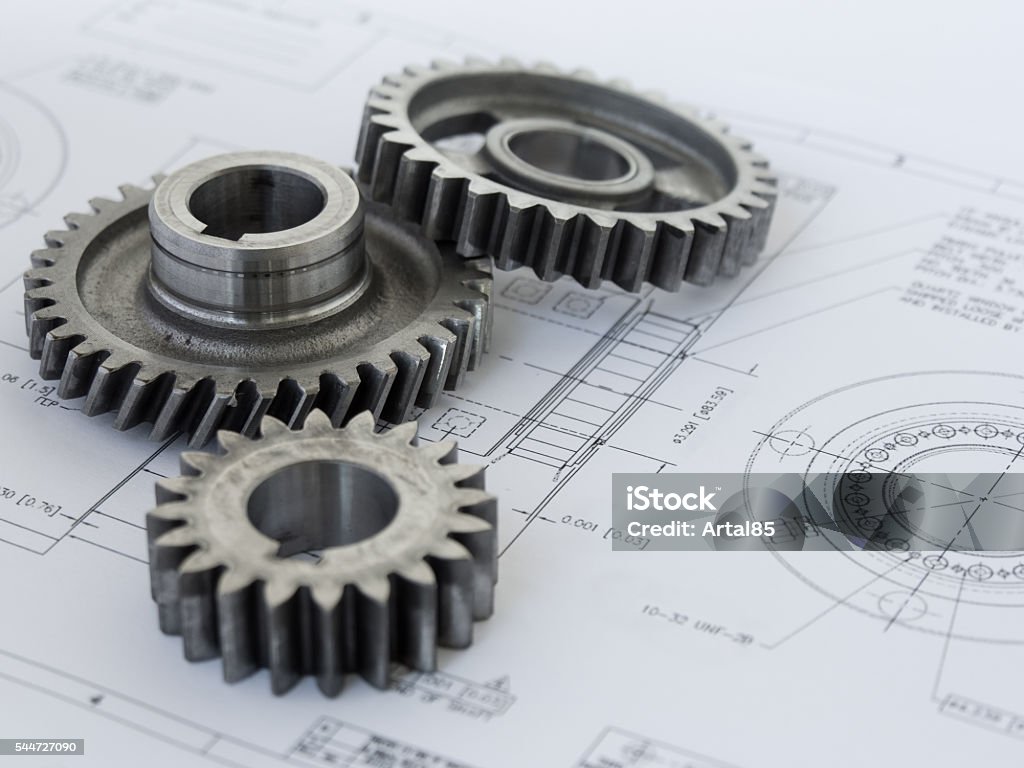 Trois engrenages sur un projet - Photo de Génie mécanique libre de droits