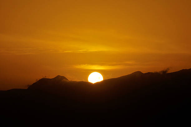 istock Sun begins to disappear behind the island 544727506