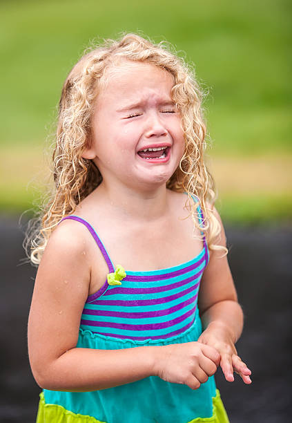 A 6 year old is outside in the winter cold and she is not happy. SEE MORE IMAGES OF THIS MODEL