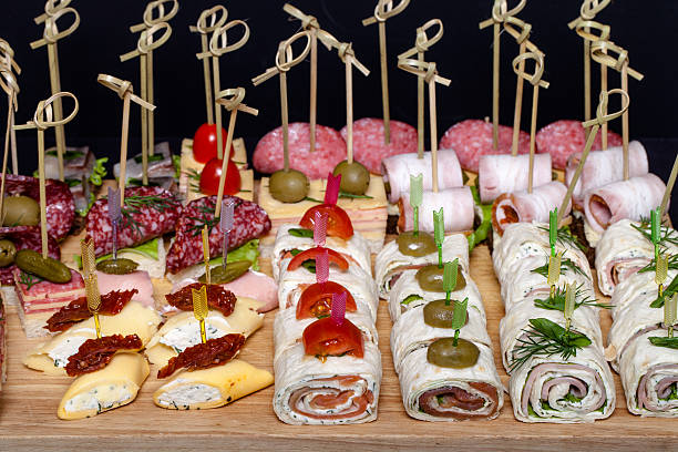 istock Different kinds of snacks canape on skewers. Selective focus 544728384