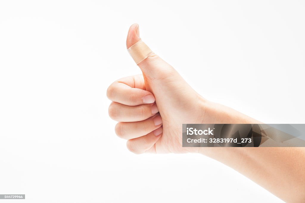Hurt finger with a bandage isolated on white Accidents and Disasters Stock Photo