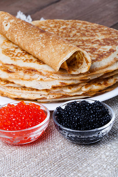 istock Russian pancakes - blini with red and black caviar 544730854